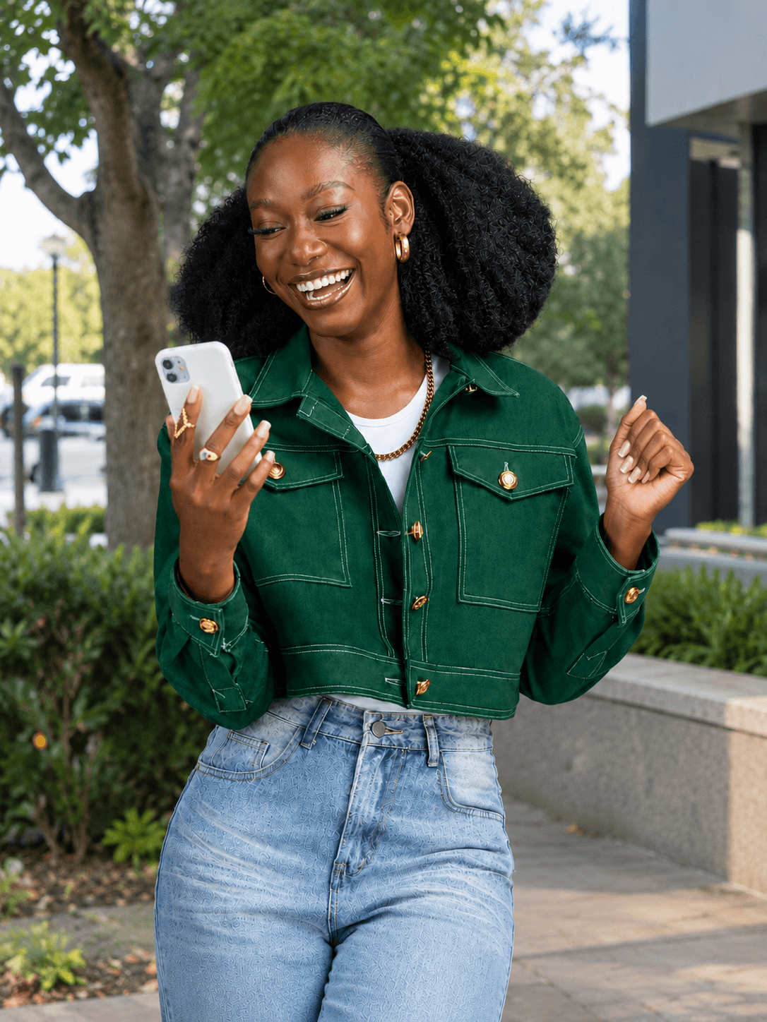 Business owner celebrating successful campaign delivery on phone